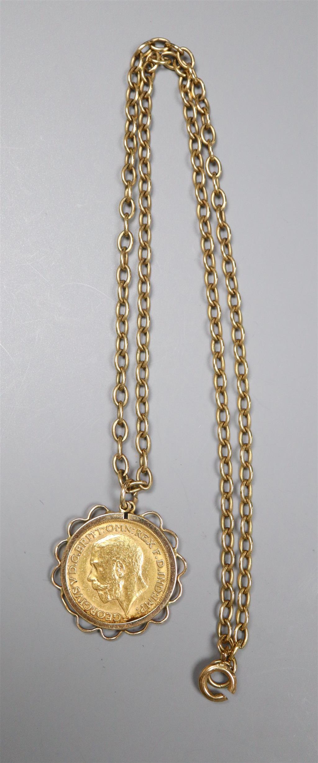 A George V 1911 gold sovereign, in yellow metal pendant mount, on a 9ct chain,